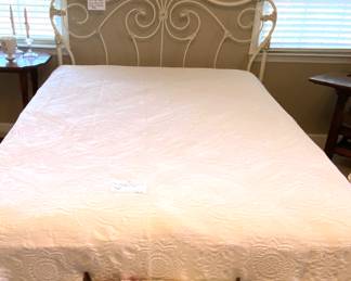 Full size iron bed, vintage coverlet and floral and wrought iron vanity stool