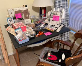 Singer Sewing machine, Serger, Notions and computer desk with wooden office chair