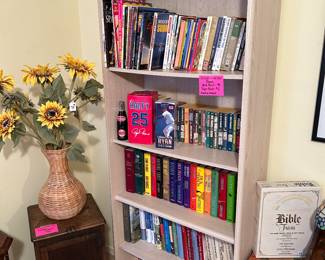 Pair of blonde wood bookshelves, books