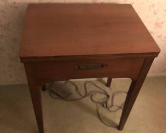 Singer Sewing Machine in Cabinet. $250. obo