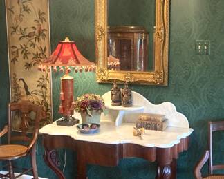 Antique marble top entry/parlor table; antique cane seat chairs; ornate mirror