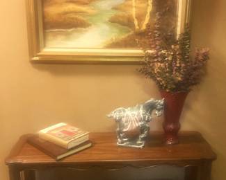 2-tier table; framed art