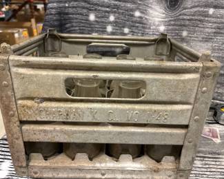 Antique metal milk crate with bottles, KCMO
