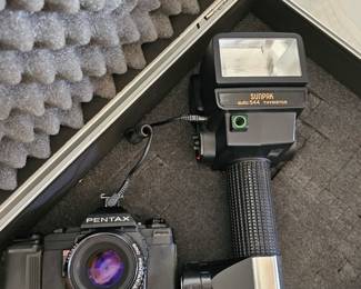 Pentax camera with accessory and case, more cameras available 