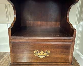 pair of nightstands being used as bases for work table