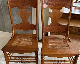 2 of 4 cane bottom, pressed back chairs