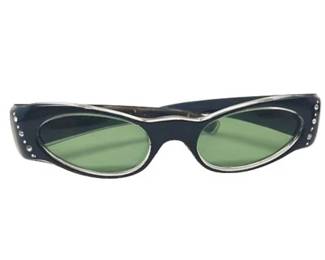 Lot 138   5 Bid(s)
1950-1960s Cat Eye Sunglasses Green Lens with Rhinestone Trim