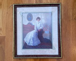 Framed print of Victorian woman on a red sofa 12" x 11"