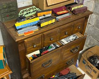 Dresser full of trains