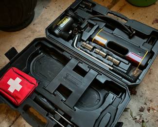 Air compressor travel emergency kit
