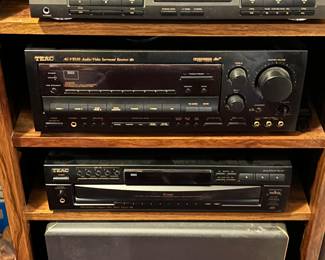 Stereo receiver, sub woofer, tape deck, cd player, cabinet