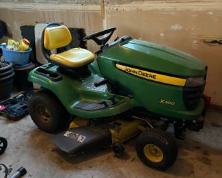 Newer and very clean John Deere riding mower with bagging system and mower cover