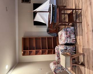 bookshleves, upholstered chairs, cocktail tables