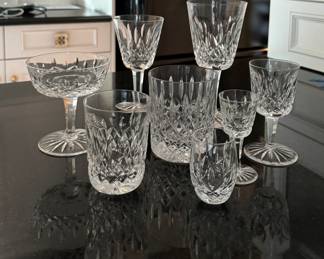 Waterford Lismore Crystal. Pictured Left to Right Back Row: Champagne Coupe (16 Available), Claret Wine (11 Available), Water Goblet (10 Available). Middle Row: Juice Glass (12 Available), Double Old Fashioned (THESE SOLD IN PRESALE). Front Row: Juice Glass (12 Available), Cordials (12 Available) Port Wine (12 Available).