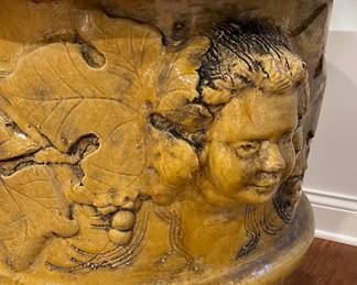Mike Bell 19th Century Yellow Jardiniere with Putti Face. Measures 28" D x 30" H. Photo 4 of 5.