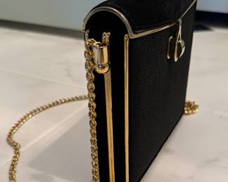 Vintage Nina Ricci Black Clutch with Gold Trim. Photo 1 of 2.