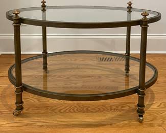 Baker Furniture Style Double Glass Shelf Brass Frame Cocktail Table On Casters. Measures 36" W x 24" D x 20" H. Photo 2 of 3.