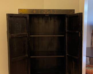 Golden Triangle Sourced Antique Ebonized Elmwood Cabinet with Gilt Butterfly Motif. Measures 33" W x 16" D x 66" H. Photo 3 of 4.