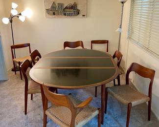 Dining Table by Grete Jalk for Poul Jeppesen ( 2 leaves) .  6 Dining Chairs by Niels Otto Moeller, 2 extra side chairs. Original Black laminate inlays to top of table.