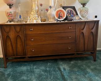 SOLD Broyhill, Brasília sideboard. Original brass pools. Three drawers, two side cabinets sculpted wood is used to open side cabinets.
SOLD- Very well-maintained collection, no damages, scratches, or dents. 
Dimensions: 19” D, 28” H, 66” W
$750, available for purchase now. Pick up only