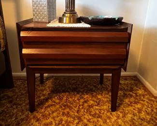SOLD- Lane first edition collection bedroom, nightstand. One drawer, cascading angles, outstanding grain pattern, no major, scratches, or significant signs of damage. 
$150, available for purchase now. Pick up only
Dimensions: 20 “H 17” D, 20” W