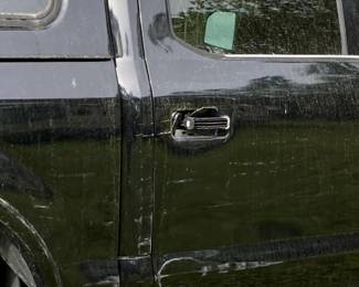 F150 has scrapes and broken door handle on passenger side