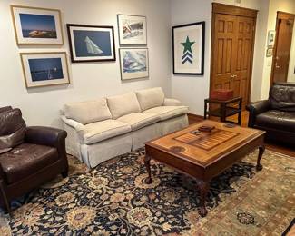 Oscar Isberian rug 9x12 $1500; Baker sofa recently recovered in chenille fabric $400; Crate and Barrel leather chairs $500  for the pair:  Nautical prints/artwork