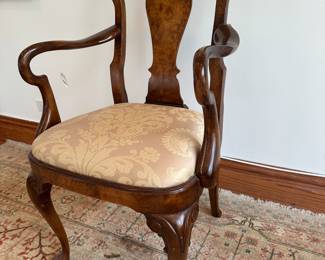 Close up photo of antique burled wood  dining chairs 