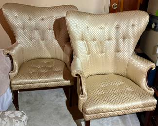 Pair button tufted wing chairs