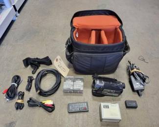 #2050 • Sony Camera, Power Cords, Batteries, Lens Hood & Bag