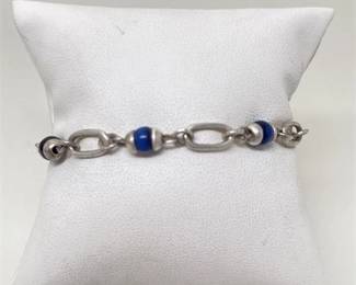 Lot 032 6 Bid(s)
Sterling Silver and Blue Star Sapphire Bead Bracelet