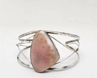 Lot 062 1 Bid(s)
Hand Made Sterling Cuff Bracelet with Raw Pink Opal Stone