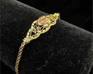Lot 039 7 Bid(s)
14K Signed Gold Bracelet with Floral Center