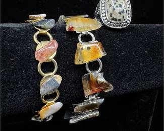 Lot 050 2 Bid(s)
Dalmatian Jasper Ring and Tumbled Brown Stone Gold Tone & Silver Tone Bracelets