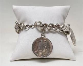 Lot 074 3 Bid(s)
Sterling Silver Curb Chain Bracelet with Three French Coin Charms