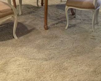 Several large floor size carpets in rolls like this