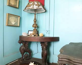 Antique carved wood Griffins table (lamp and fans sold)