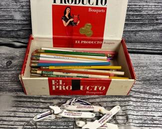 Cigar box full of pencils, and pens