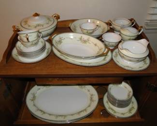 Vintage complete china set, we have 3 different sets, this one just happens to be displayed on a Mid Century Modern liquor/bar serving cabinet