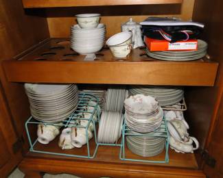 Holding back on that vintage china, and presto, that is a vintage liquor cabinet