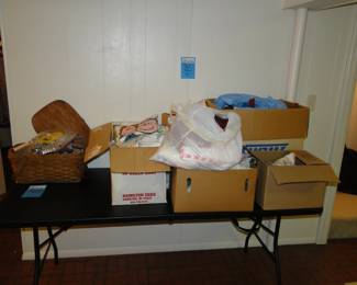 The basket on the left is cookie cutters at $2 each, and the boxes contain fabric that for only $5 a bag you can fill