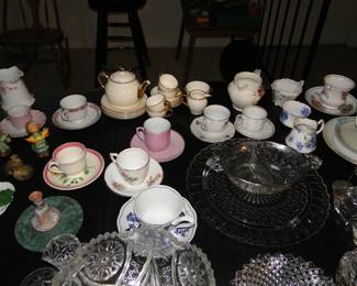 Lots and lots of vintage cups and saucer sets, pressed and etched glass too.