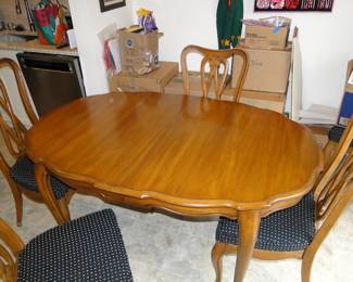 This table has always been covered, not a mark on it and complete with six chairs