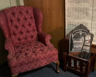 A VERY comfy upholstered wing back chair, arts and crafts magazine rack and a vintage mirror! 