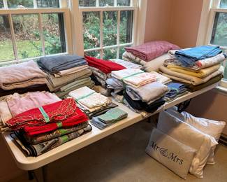 And yes, we have the obligatory table of linens! Towels, hand towels, table cloths, napkins, place mats, sheets,  blankets, afghans and quilts!!

Plus some vintage hand made doilies and lovely embroidered linens! 