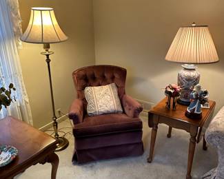 Preliminary walkthrough photo: 

One of a pair of plumb colored swivel chairs! Nice end tables and lamps throughout! 