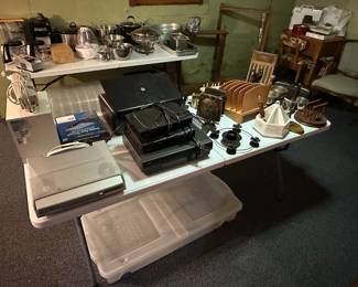 A table full of whatnots and some small electronics! 