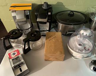 A pair of Keurig's, Crock Pot, Dehumidifier and an old fashioned meat grinder in the original box! 
