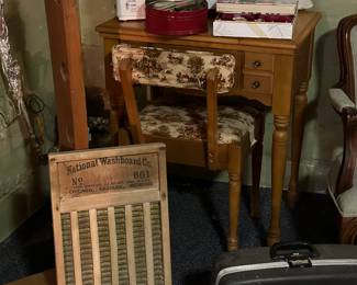 Singer sewing machine and lots of supplies! Hanging out at the bottom right of this photo is a great vintage typewriter! 