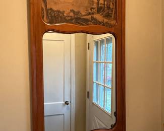 Preliminary walkthrough photo: 

Lovely entry way mirror! Pastoral scene!